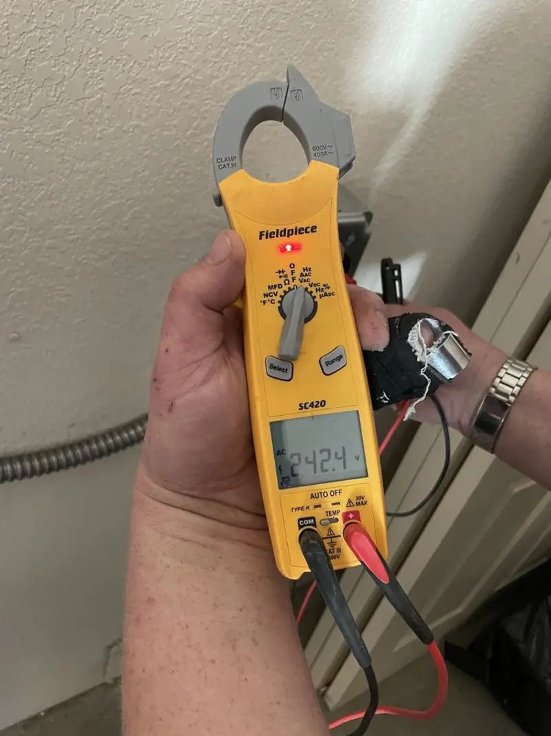 Voltage testing with clamp meter during Recessed Lighting Installation in Sumpter